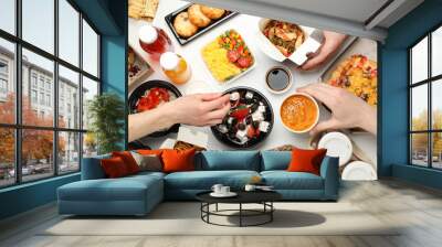 People eat takeaway. Food delivery. Tasty food on white table Wall mural