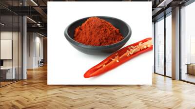 Red hot chili pepper powder and half isolated on white background Wall mural