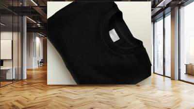 Stylish blank black sweatshirt on white table Wall mural