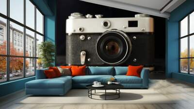 Vintage photo camera on dark background, closeup Wall mural