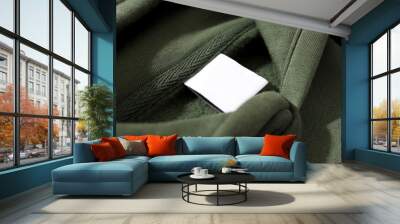 Warm stylish clothes with blank white label Wall mural