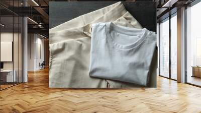 White t-shirt and sweatpants on dark wooden background Wall mural