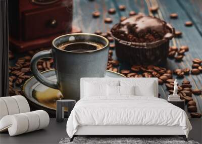 Cup of coffee on a blue wooden table with coffee beans and a chocolate Wall mural