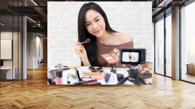 Beautiful Asian woman professional beauty vlogger recording makeup tutorial video Wall mural