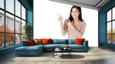 beautiful young asian woman pointing hands to empty space aside Wall mural