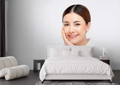 Beauty shot of bright skin Asian woman with hand touching face Wall mural