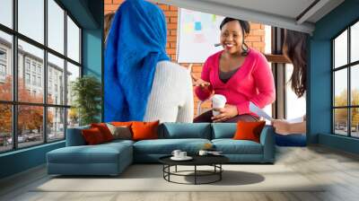 Diverse group of women in colorful clothes at the meeting Wall mural