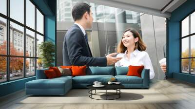 Group of business colleagues talking in front of office building Wall mural