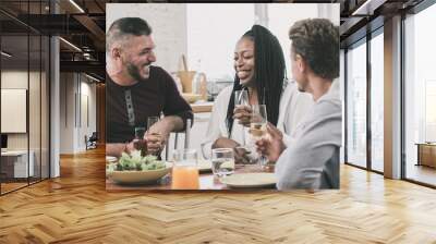 Group of happy multiethnic friends having dinner party at home Wall mural