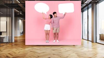 Lovely young Asian couple with speech bubbles Wall mural