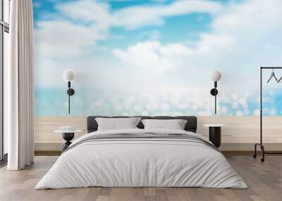 Wood table top on blur sparkling sea water and summer sky background Wall mural