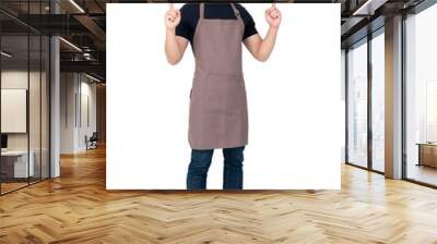 Young handsome Asian barista pointing up in studio white background Wall mural