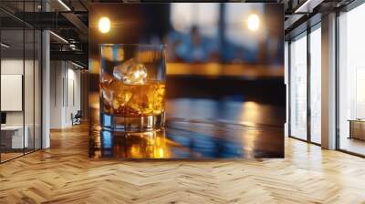 A glass of premium whiskey on the rocks, set on a dark wooden bar with a soft ambient light highlighting the golden hues of the drink Wall mural