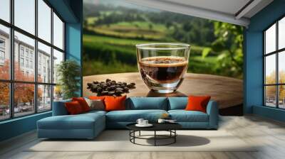 espresso coffee in clear glass with smoke on an old wooden table, the green field is the background Wall mural