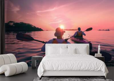 two people kayaking in a lagoon at sunset Wall mural