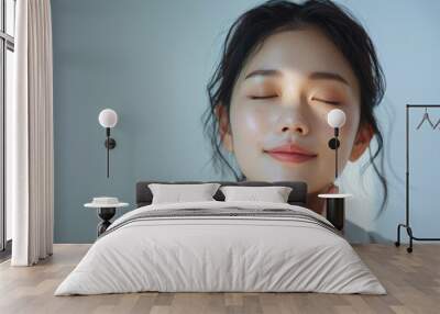 Serene Asian Woman Enjoying Skincare Routine Wall mural