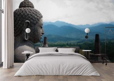 Stone budhha sideview in front of two stupas, Borobudur Wall mural