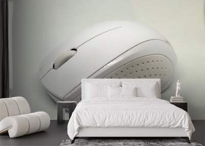 A white wireless mouse - lateral view Wall mural