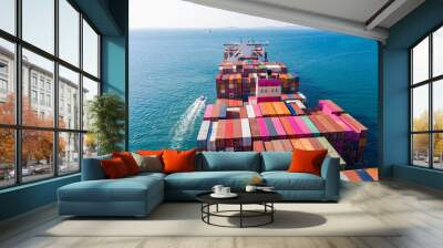 Rear view cargo container ship.  Business logistic transportation sea freight,Cargo ship, Cargo container in factory harbor at industrial estate for import export around in the world, Trade Port. Wall mural