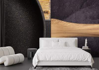 detail of black pan with wooden handle Wall mural