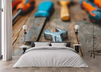 close-up of a wrench and other tools on a rustic wooden table for diy, repair, and construction projects Wall mural