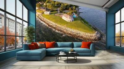 Aerial view of sunrise on island with green lawn and resort houses of Long Island, New York Wall mural