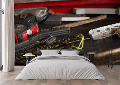 A pile of tools on a carpenter's workbench. Wall mural