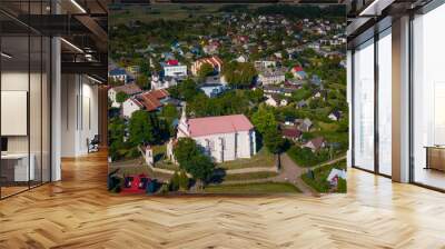 Merkine town and church on the bank of Nemunas and Merkys river in Lithuania next to Merkine mound  Wall mural