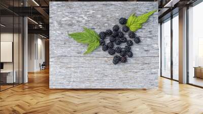 blackberry with leaves on old wooden background Wall mural