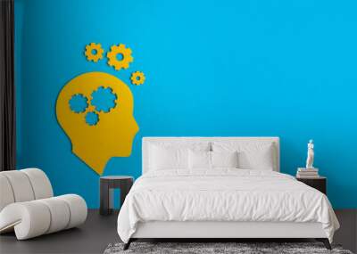 Brain works concept. Thinking, creativity concept of the human head with gears on blue background Wall mural