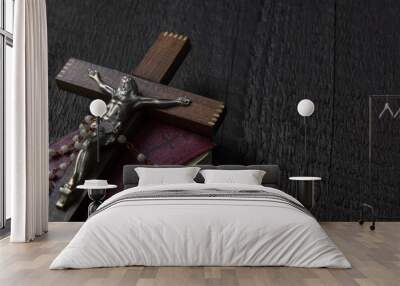 Christian cross on wood bible and rosary beads over wooden vintage background Wall mural