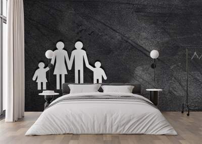 White figures of the family on a grey table. Wall mural