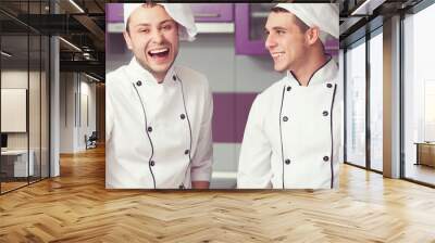 Cooking process, perfect teamwork concept. Portrait of two men Wall mural