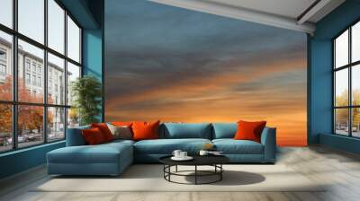 Heaven at early morning with copy space. Sunset, sunrise backdrop.Predawn clear sky with orange horizon and blue atmosphere. Smooth orange blue gradient of dawn sky. Wall mural