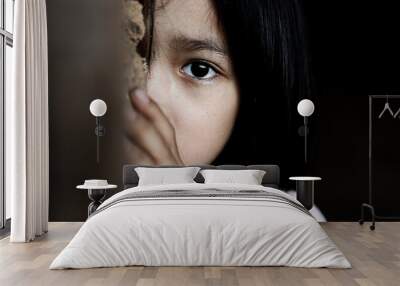 Little girl with eye sad and hopeless. Human trafficking and fear child concept. Wall mural