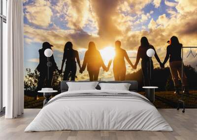 silhouette of friends girls group standing at sunset time Wall mural