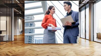 Business team discussing on business project outside office building, urban city Wall mural