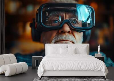 An elderly man with a white beard wears VR goggles and looks into the distance. Wall mural