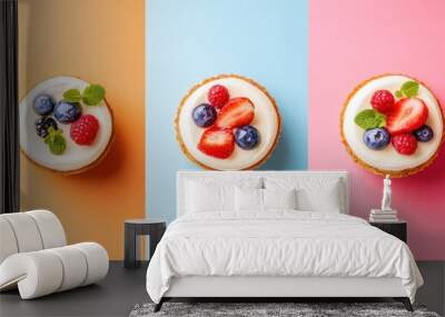 Three mini cakes with whipped cream and berries on colorful background. Wall mural