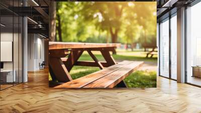 wood picnic tables in the park blurry background Wall mural