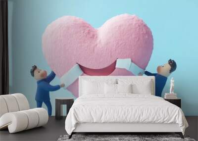 Two figures repair a large pink heart, symbolizing love, partnership, and emotional healing in a creative and playful manner. Wall mural