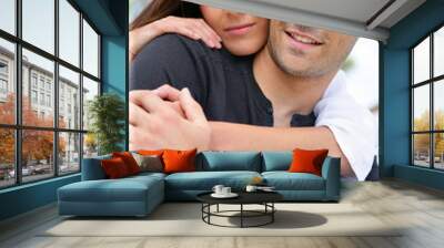 attractive couple hugging outdoors Wall mural