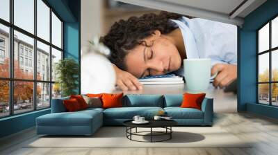 beautiful young woman sleeping on a desk at work Wall mural