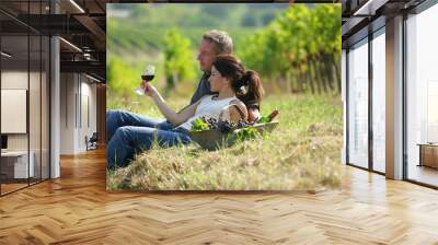 Couple tasting wine at a vineyard Wall mural