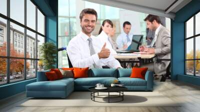 Disabled businessman smiling in office Wall mural