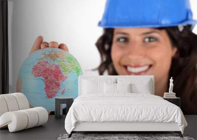 Female architect holding miniature globe Wall mural