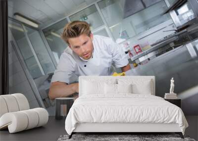 kitchen chef cleaning the restaurants kitchen Wall mural