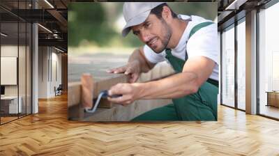 man with work clothes in workshop Wall mural