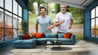 men jogging outdoor in nature - motion blur image panning Wall mural