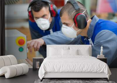 men wearing dust masks starting machinery Wall mural